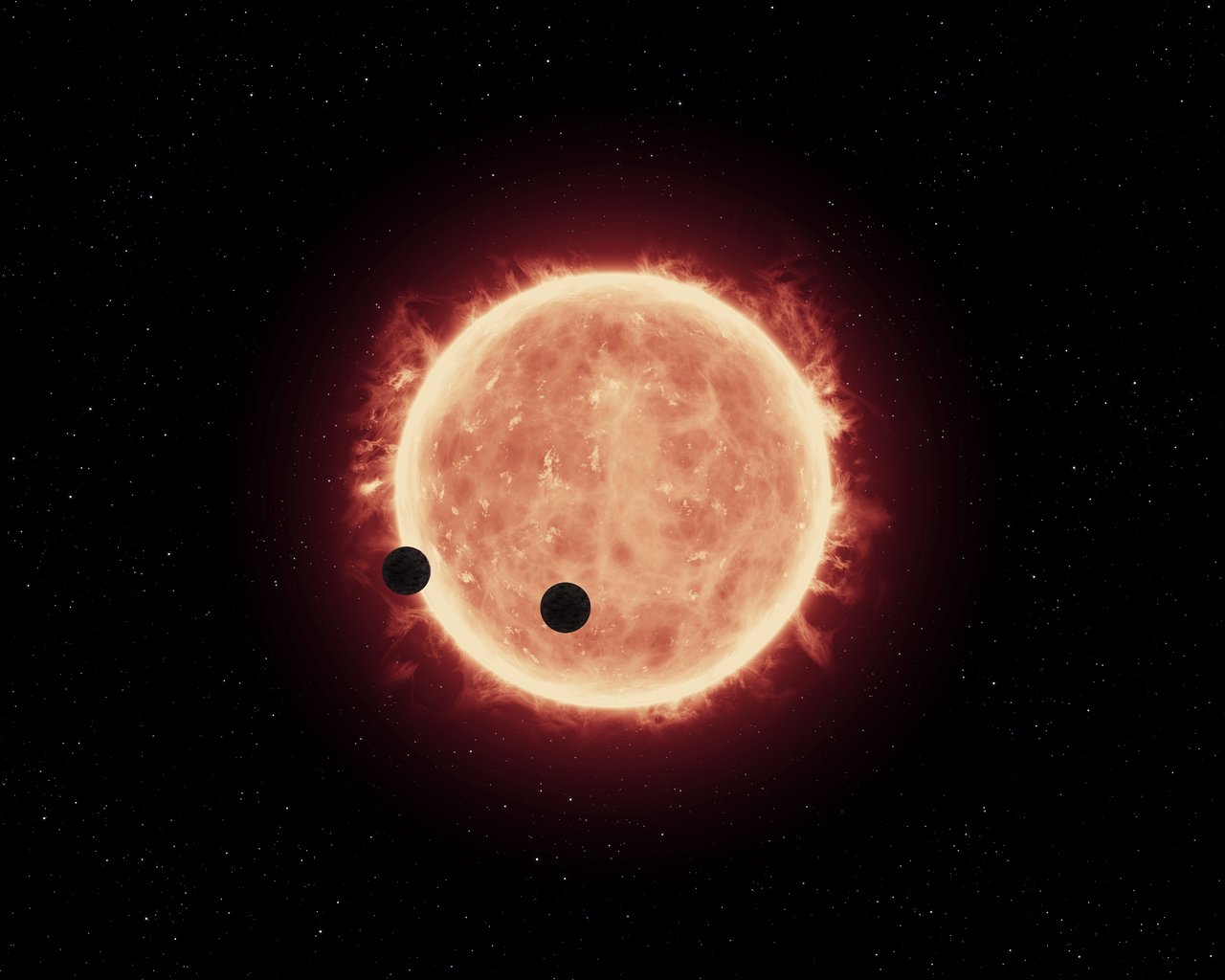 artists_view_of_planets_transiting_red_dwarf_star_in_trappist-1_system