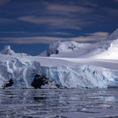 1200px-glacier_on_antarctic_coast_mountain_behind1