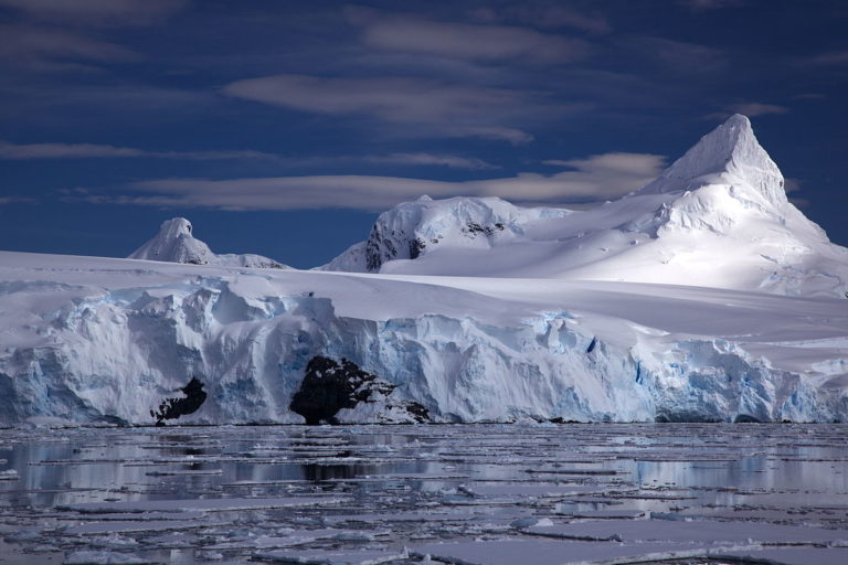 1200px-glacier_on_antarctic_coast_mountain_behind1