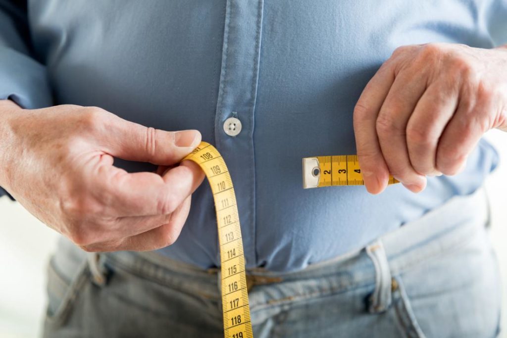 senior-man-checking-his-waist-circumference