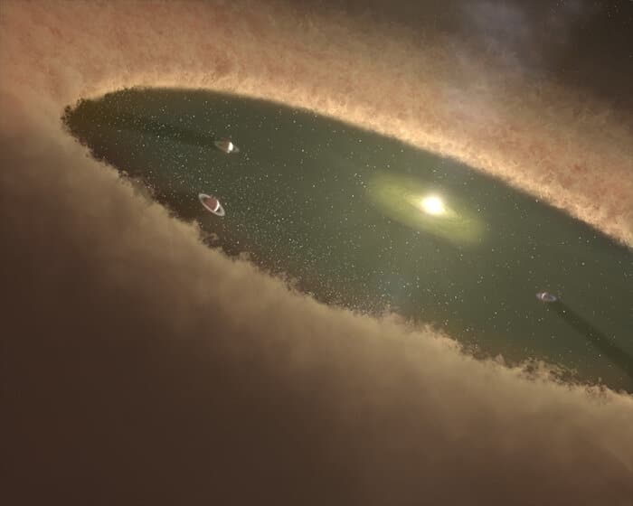 Иллюстрация молодой Солнечной системы. Протопланетный диск еще не рассеялся