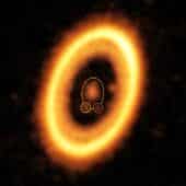 На изображении ALMA пунктиром выделено скопление пыли, которое может быть зародышем новой планеты на орбите газового гиганта PDS 70 с