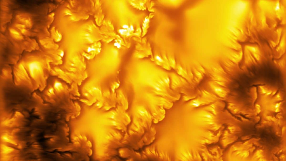 High-resolution solar surface image showing small bright and dark swirling patterns.
